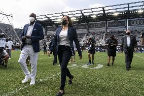 Kamala Harris flips a coin ahead of Howard University vs Hampton University football game