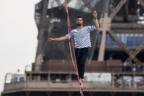 Nathan Paulin Traverses A Slackline Between The Eiffel Tower And The Chaillot Theater