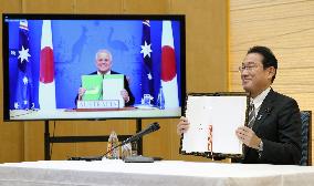 Japan, Australia sign defense cooperation pact