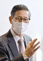 Japan's top COVID-19 adviser Omi