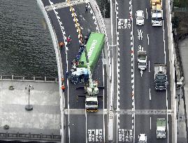 Overturned trailer on highway in Osaka