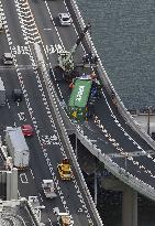 Overturned trailer on highway in Osaka