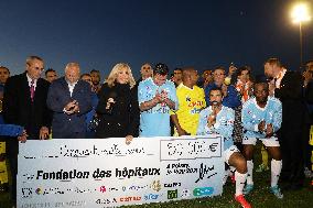 Brigitte Macron Is Given A Check - Poissy