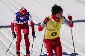 (SP)CHINA-ZHANGJIAKOU-WINTER PARALYMPICS-PARA CROSS-COUNTRY SKIING -WOMEN'S LONG DISTANCE CLASSIC VISION IMPAIRED(CN)