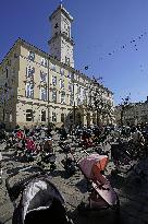 Empty buggies for Ukraine children victims