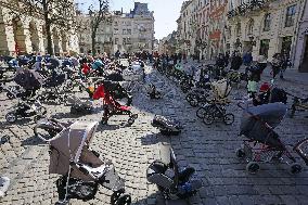 Empty buggies for Ukraine children victims