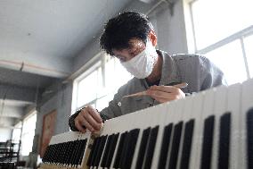 CHINA-LIAONING-YINGKOU-PIANO MAKING-RESUMPTION (CN)