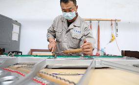 CHINA-LIAONING-YINGKOU-PIANO MAKING-RESUMPTION (CN)