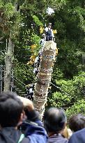 Huge trunk raised vertically in Japan festival