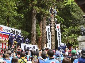 Huge trunk raised vertically in Japan festival