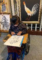 INDONESIA-BALI-G20-DISABLED PAINTER