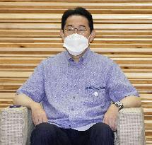 Japan PM Kishida in Okinawa shirt