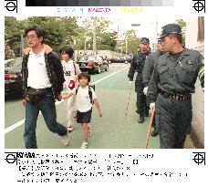 Parents escort schoolchildren