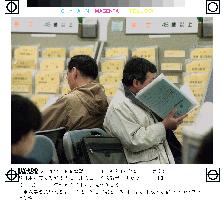 Job seekers at placement agency