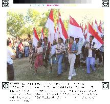 Pro-Jakarta militiamen march in E. Timor