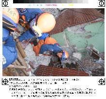 Japan rescue team probing quake damage to building