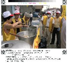 Volunteers preparing emergency meals for Taipei quake victims