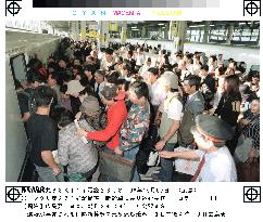 Travelers rush to bullet train as service resumes