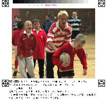 Japanese member teaches Welsh boys how to play rugby