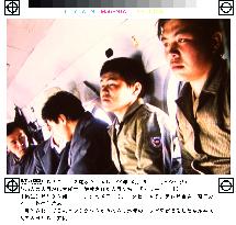 Freed Kyrgyz policemen say Japanese hostages are safe