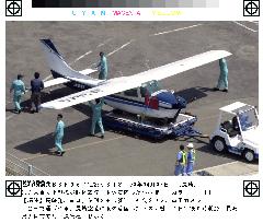 Light plane belly-lands at Nagasaki airport