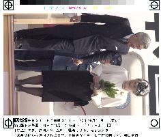 Imperial couple return to Tokyo from Europe