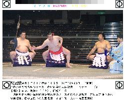Taiho strikes pose in red yokozuna to mark 60th birthday