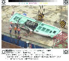 Fishing boat hauled on shore after collision