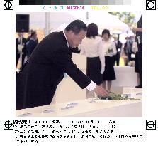 Mori lays flowers in Okinawa ceremony