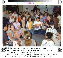 32 foreign disaster orphans arrive in Japan