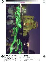 Hiroshima citizens hold lights around A-Bomb Dome