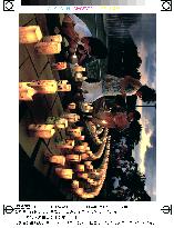 Children light candles, pray for elimination of nuclear weapons