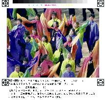 Multi-colored capes-wearing Japanese delegates march into stadiu