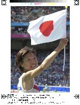 Takahashi waves flag after winning Olympic women's marathon