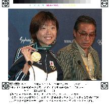 Marathon winner Takahashi shows off her gold medal