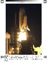 Discovery blasts off