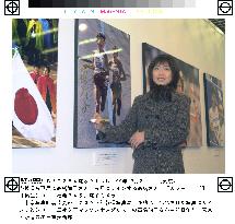 Gold medalist Takahashi attends photo exhibition