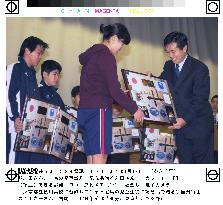 Astronaut Wakata gives shuttle collages to young evacuees