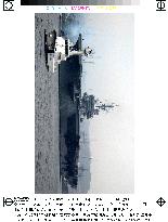 U.S. aircraft carrier Kitty Hawk leaves Yokosuka