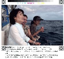 Relatives of Ehime Maru victims visit shallow-water site