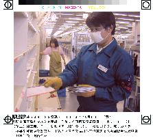 Post office employee works with gloves and mask