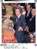 Koizumi pledges to push through reforms