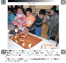 Japanese volunteers cheer up Palestinian refugees