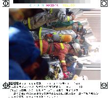 Fire fighters check Narita airport walkway