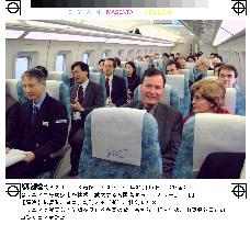 Senior officials from 9 countries ride maglev train