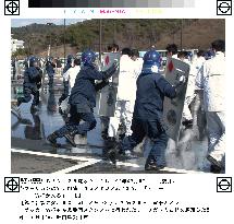 Shizuoka police conduct drills on combating soccer hooligans