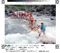 Tourists enjoy rafting on river