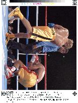 Champion crumbles to canvas in WBA super bantam title fight