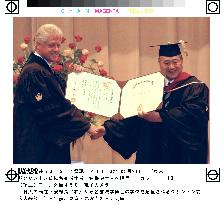 Clinton receives honorary degree from Nihon University