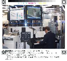 NTT East gives piano lesson demonstration via Net video phone